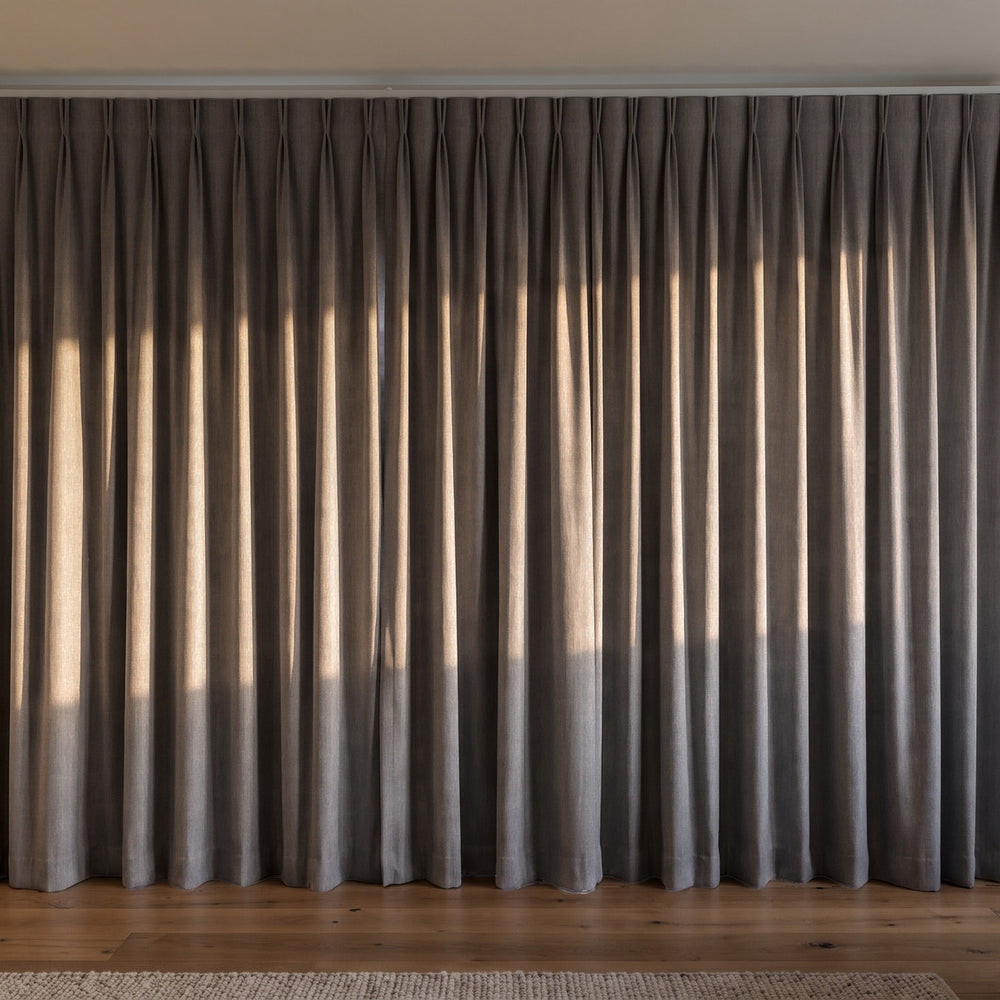 Breakaway Blockout Curtain in Charcoal, twin pleat on a ceiling track