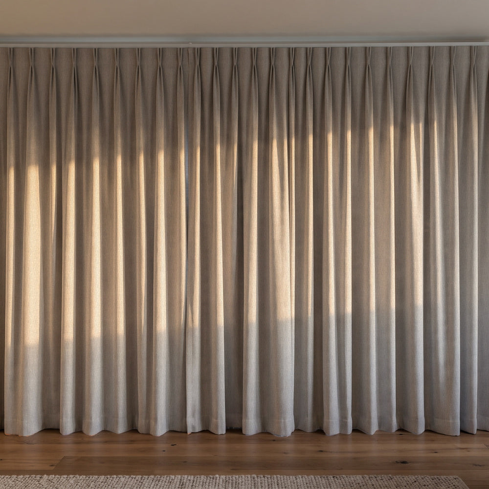 Breakaway Blockout Curtain in Pebble, twin pleat on a ceiling track