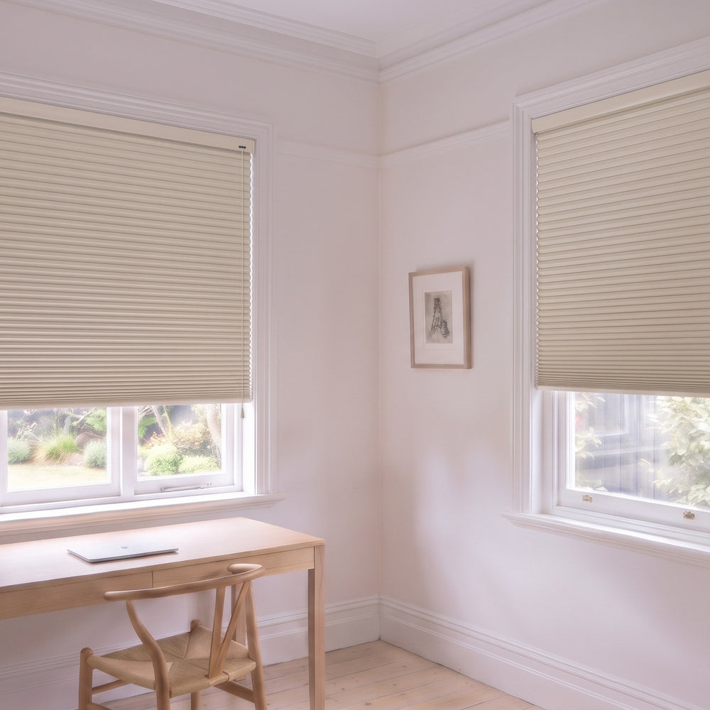 Honeycomb Blockout Corded Blind in Alabaster, recess fitted in a study with two windows