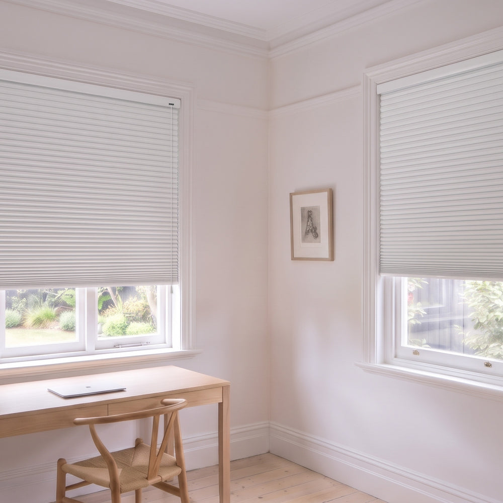 Honeycomb Blockout Corded Blind in Cotton, recess fitted in a study with two windows