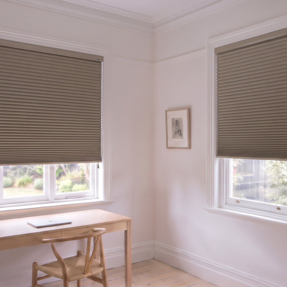 Honeycomb Blockout Corded Blind in Fawn, recess fitted in a study with two windows