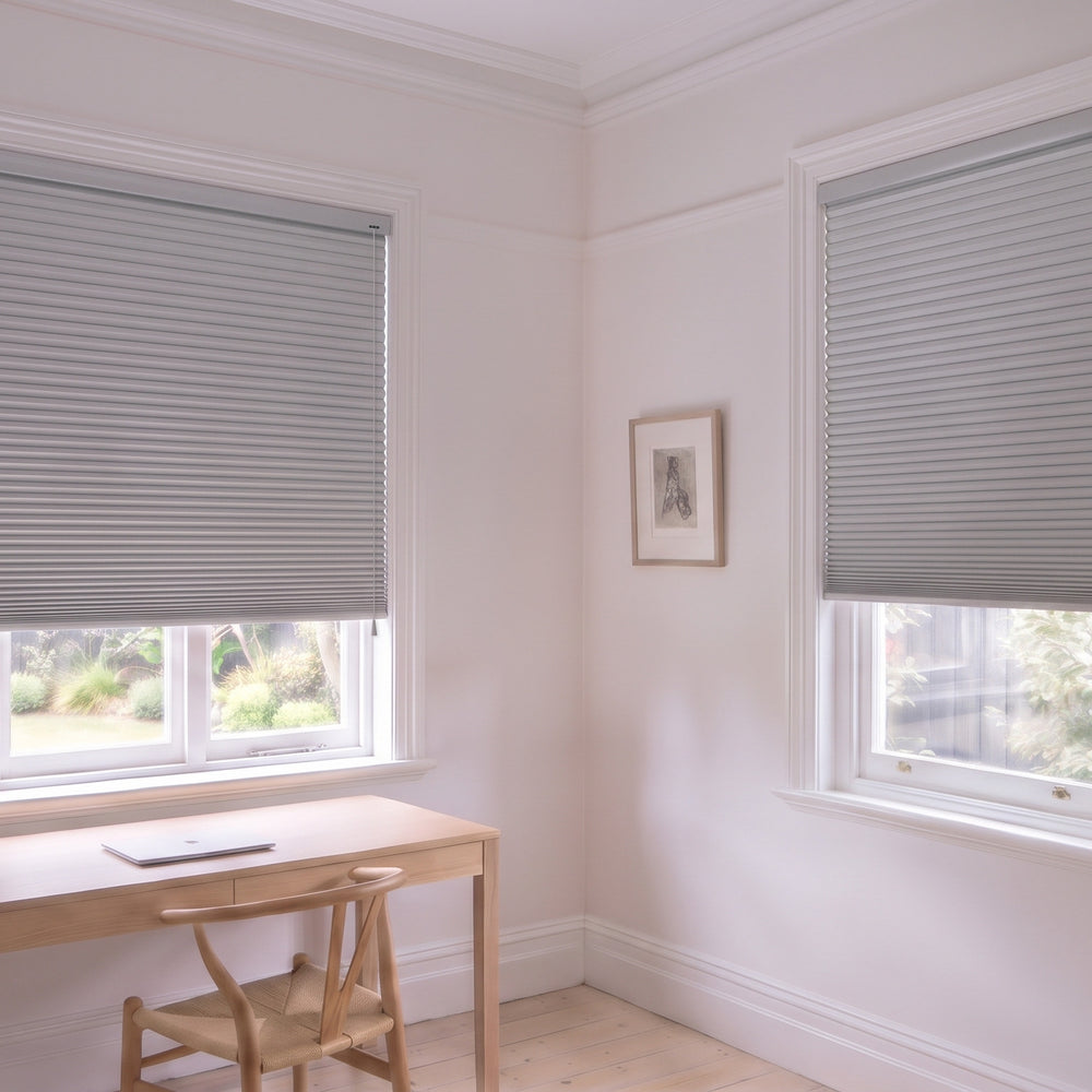 Honeycomb Blockout Corded Blind in Grey Sheen, recess fitted in a study with two windows