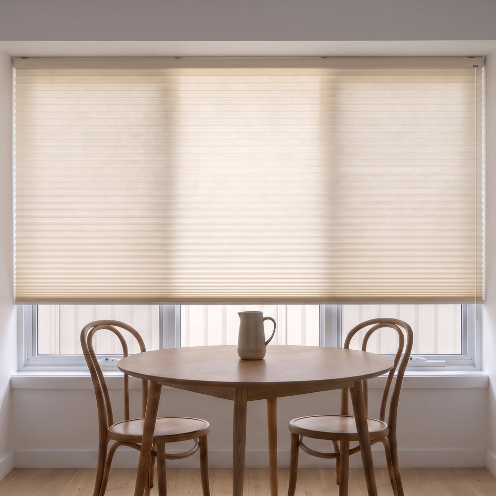 Honeycomb Light Filtering Corded Blind in Alabaster, recess fitted in a kitchen dining nook window