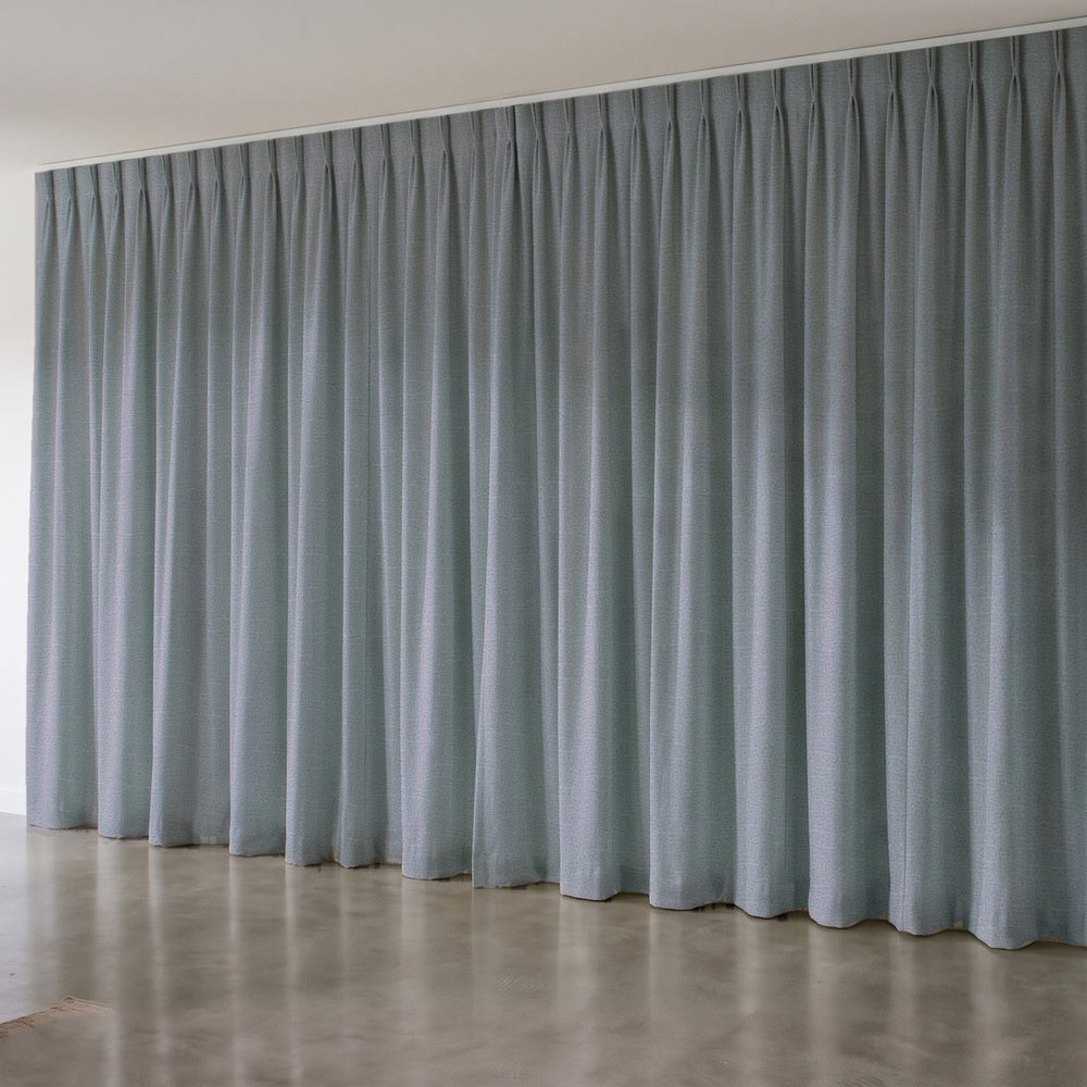 Harris Blockout Curtain in Delta, twin pleat on a ceiling track