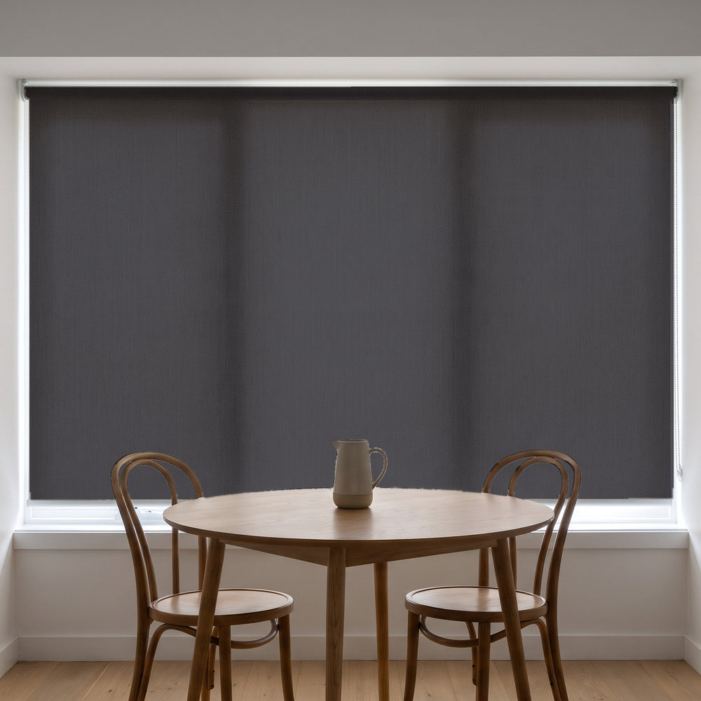 Jersey Light Filtering Roller Blind in Basalt, recess fitted in a kitchen nook window