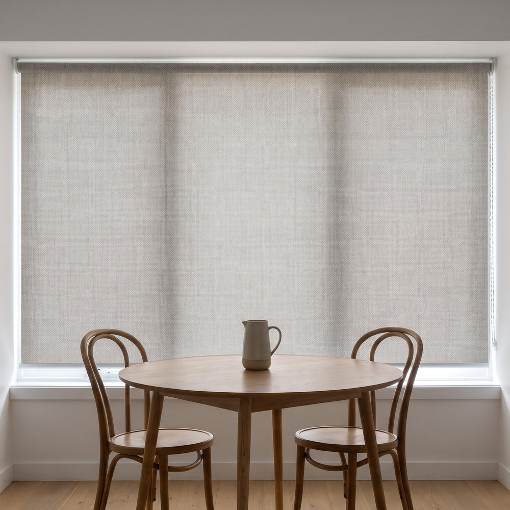 Jersey Light Filtering Roller Blind in Cinder, recess fitted in a kitchen nook window