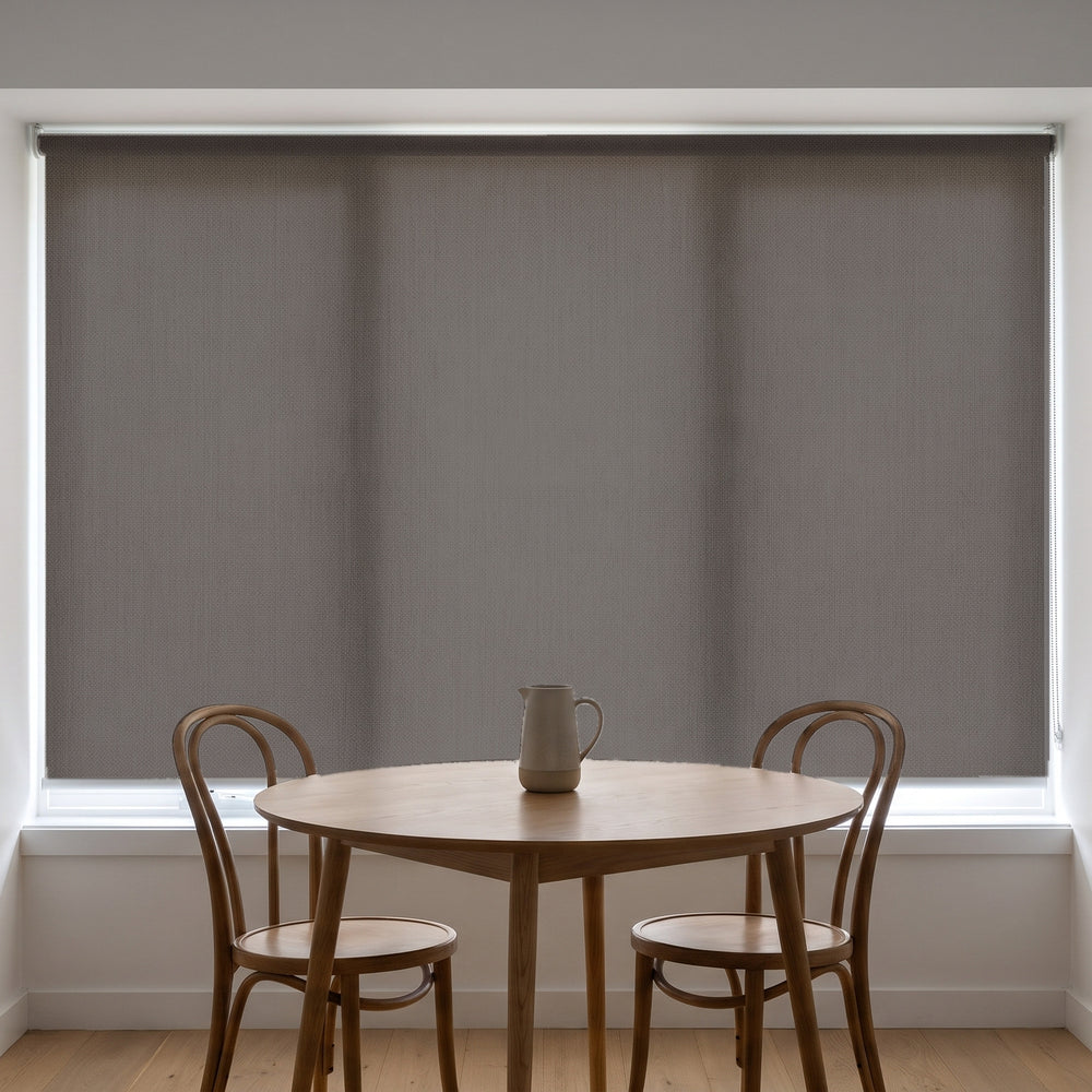 Jersey Light Filtering Roller Blind in Sable, recess fitted in a kitchen nook window