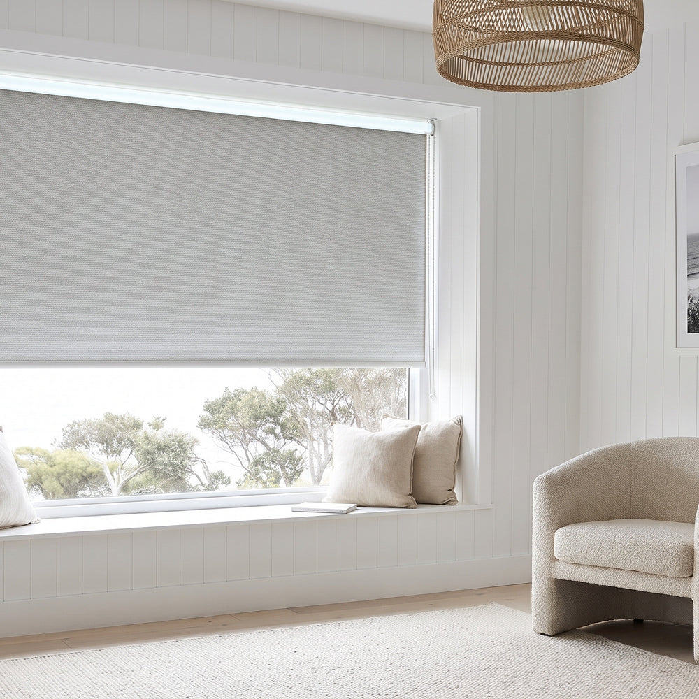 Linesque Blockout Roller Blind in Blanco, recess fitted in a living room window