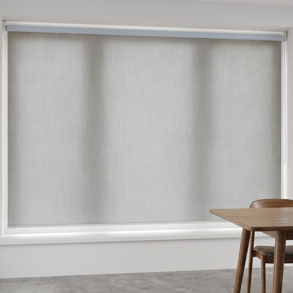 Linesque Light Filtering Roller Blind in Owl, recess fitted in a dining room window