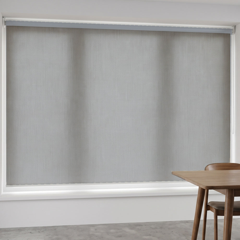 Linesque Light Filtering Roller Blind in Winter, recess fitted in a dining room window