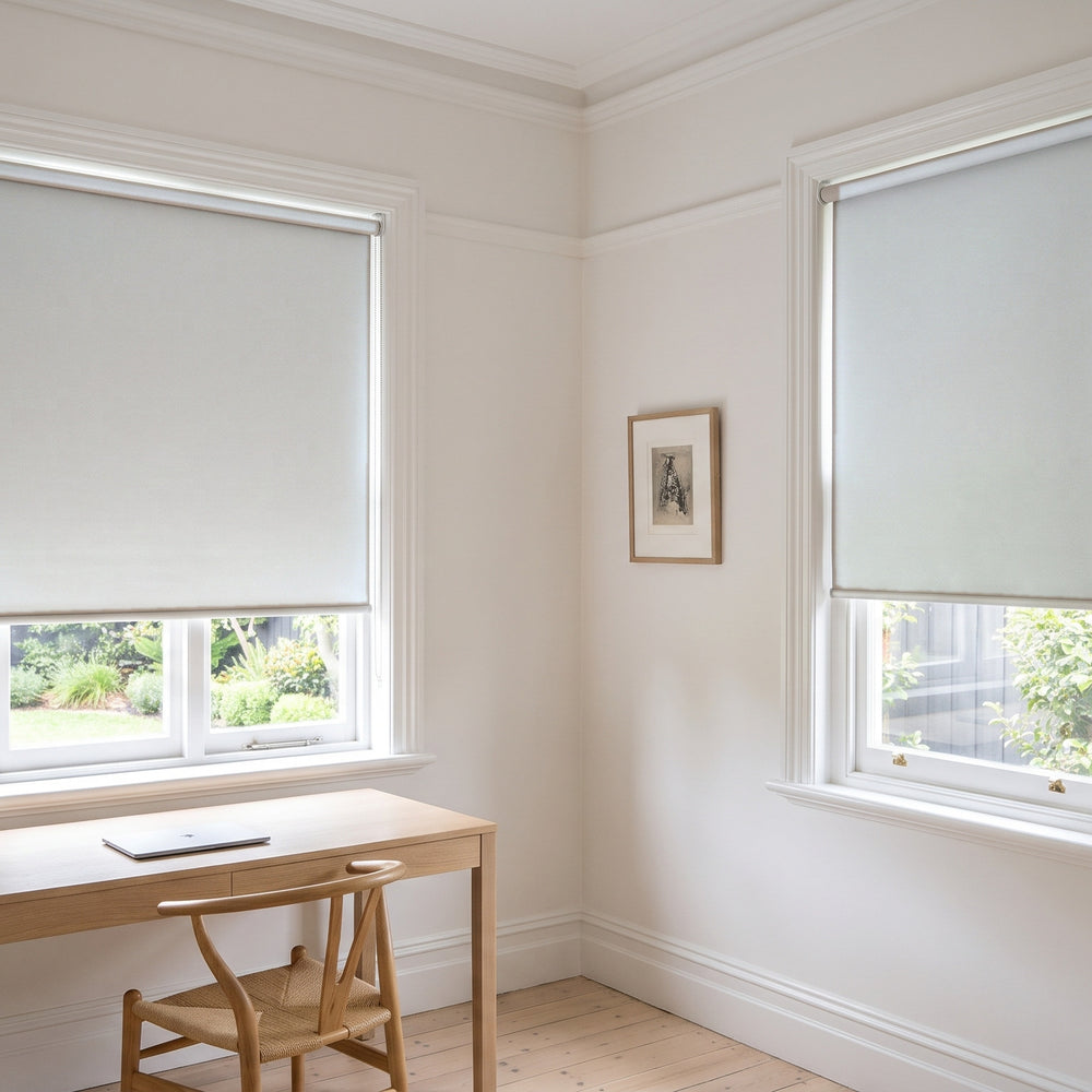 Quest Blockout Roller Blind in Glacier, recess fitted in a study window