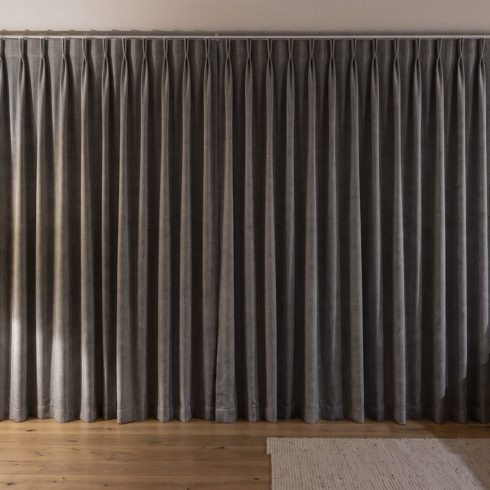 Weylands Blockout Curtain in Carbon, twin pleat on a ceiling track