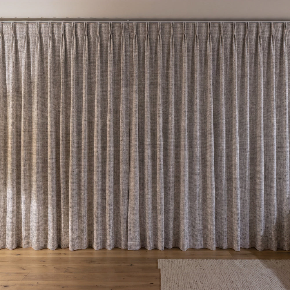 Weylands Blockout Curtain in Feather, twin pleat on a ceiling track
