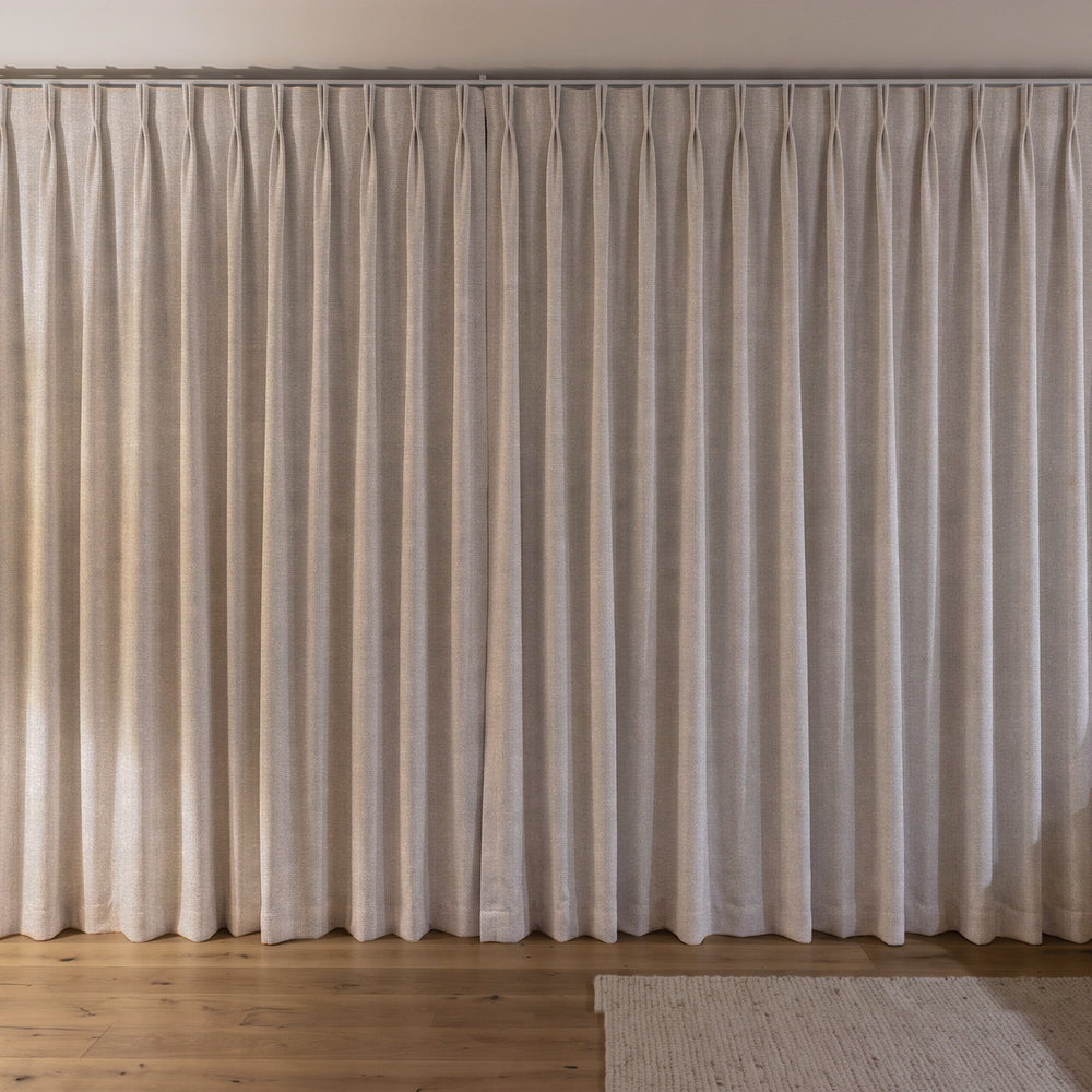 Weylands Blockout Curtain in Flax, twin pleat on a ceiling track