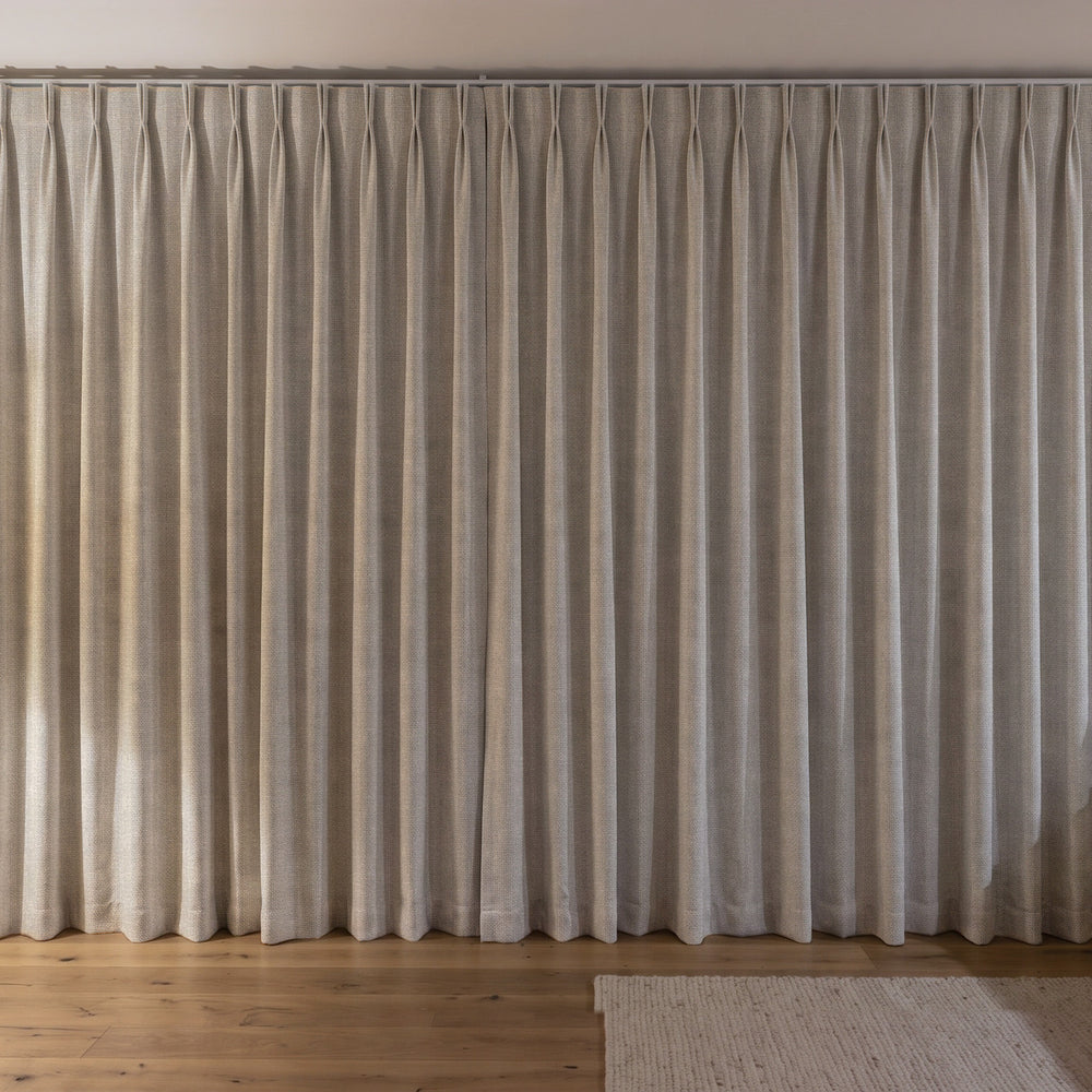 Weylands Blockout Curtain in Parchment, twin pleat on a ceiling track
